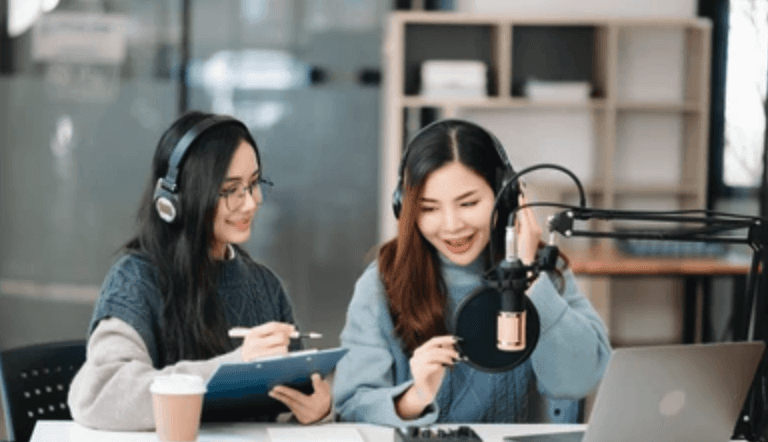 Two people making a podcast