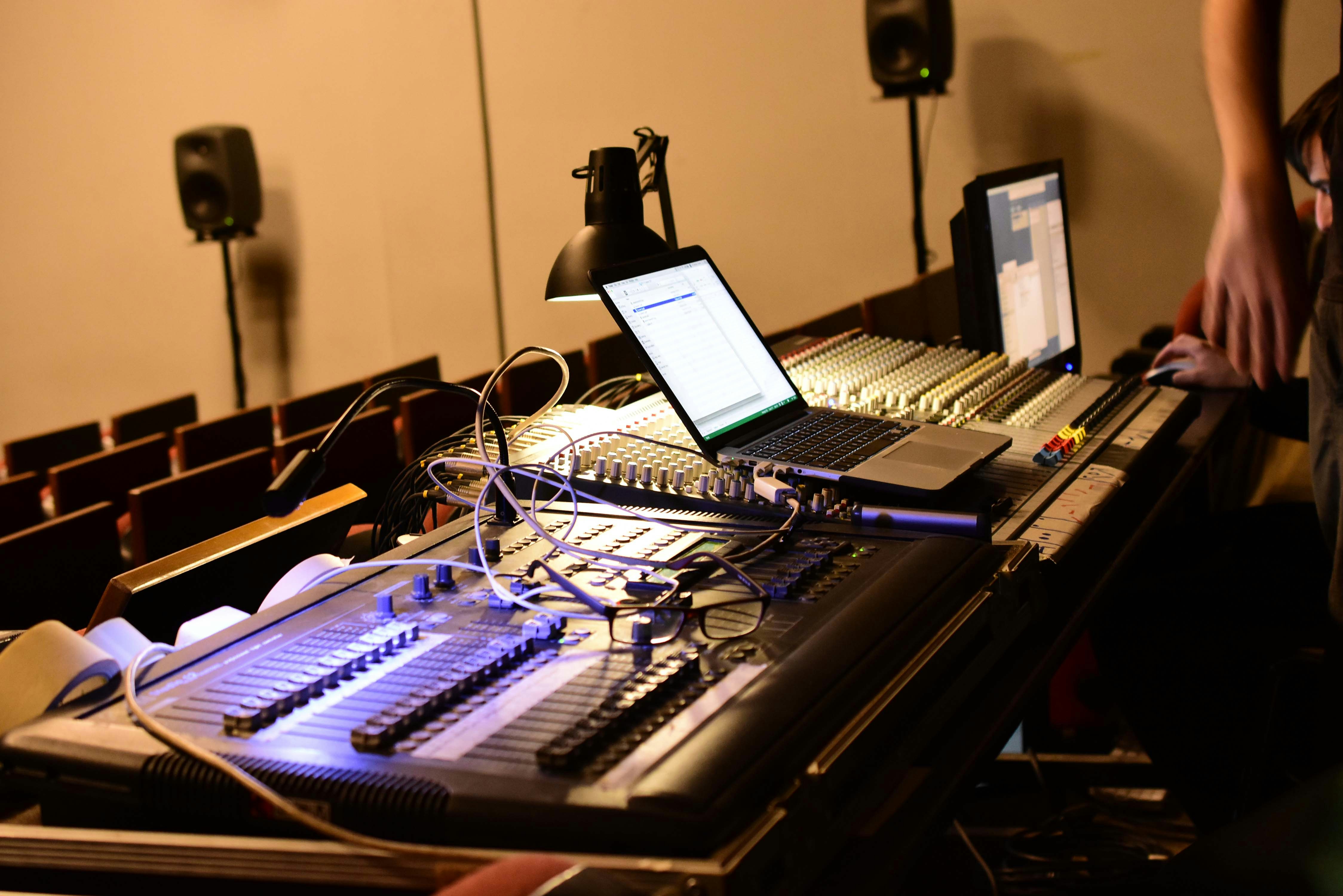 Music production and mixing gear in a studio setting. Photo by Konstantinos Papadopoulos on Unsplash