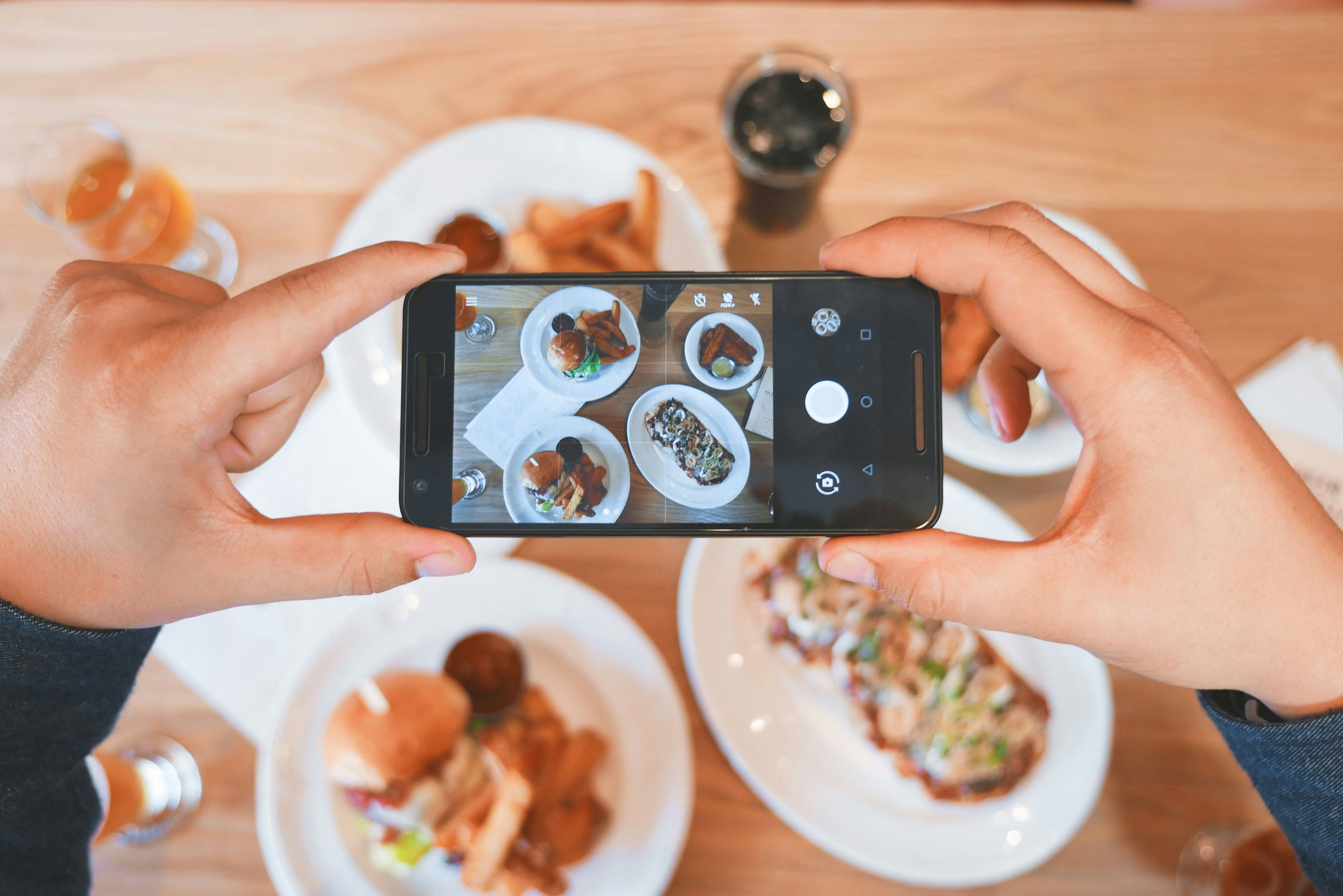 A phone setup filming scenes of food